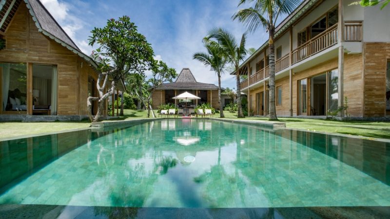 Balinese-style villa mixed with traditional Javanese Joglo architecture overlooking the rice paddies