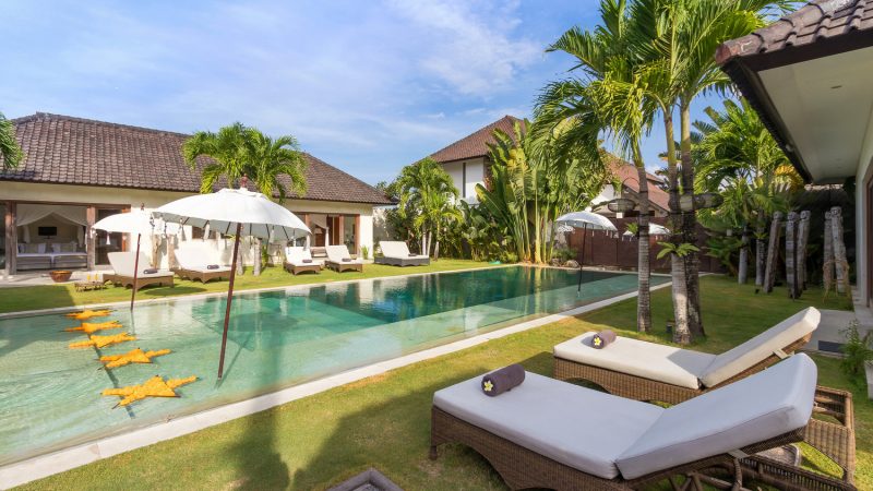 18 meter swimming pool surrounded by sun loungers to sunbathe after a cool dip in the pool