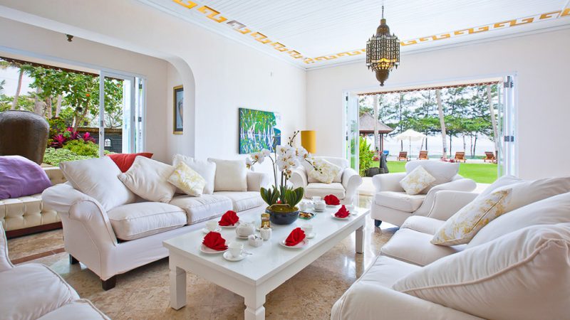 relax in a bright white, enclosed living area in Villa Puri Nirwana